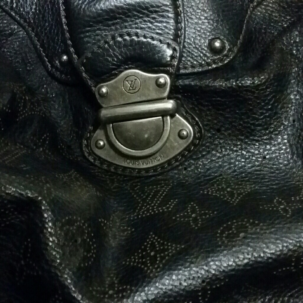 'Solar' Black Mahina leather with perforated monog